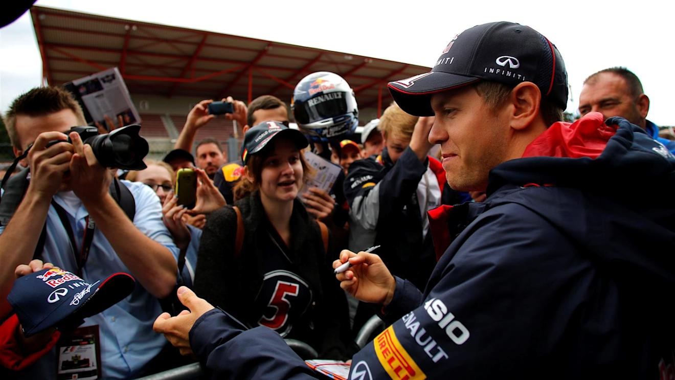 Sebastian Vettel (GER) Red Bull Racing signs autographs for the fans. Formula One World Championship, Rd12, Belgian Grand Prix, Preparations, Spa-Francorchamps, Belgium, Thursday, 21 August 2014
