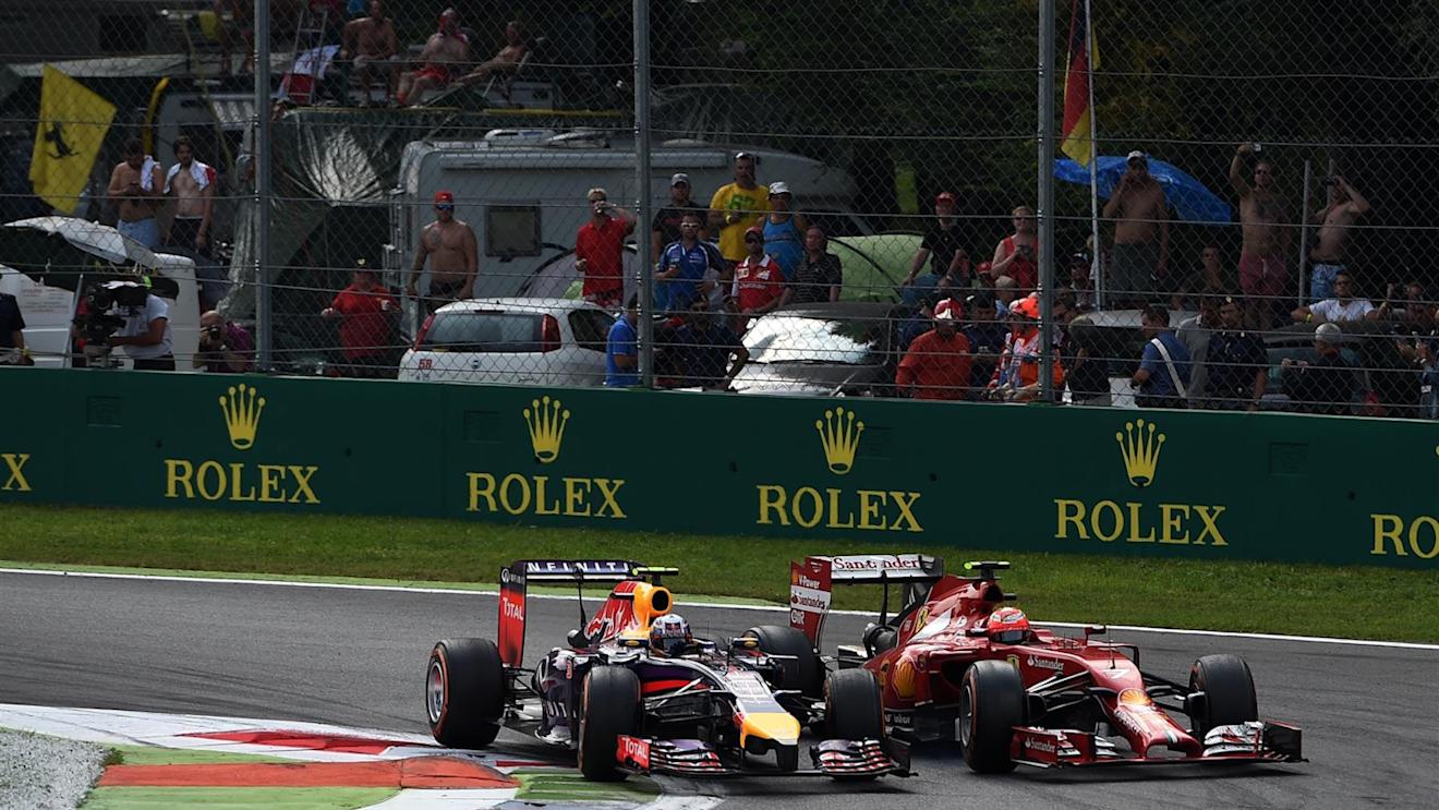 Daniel Ricciardo (AUS) Red Bull Racing RB10 and Kimi Raikkonen (FIN) Ferrari F14 T battle. Formula One World Championship, Rd13, Italian Grand Prix, Monza, Italy, Race Day, Sunday, 7 September 2014
