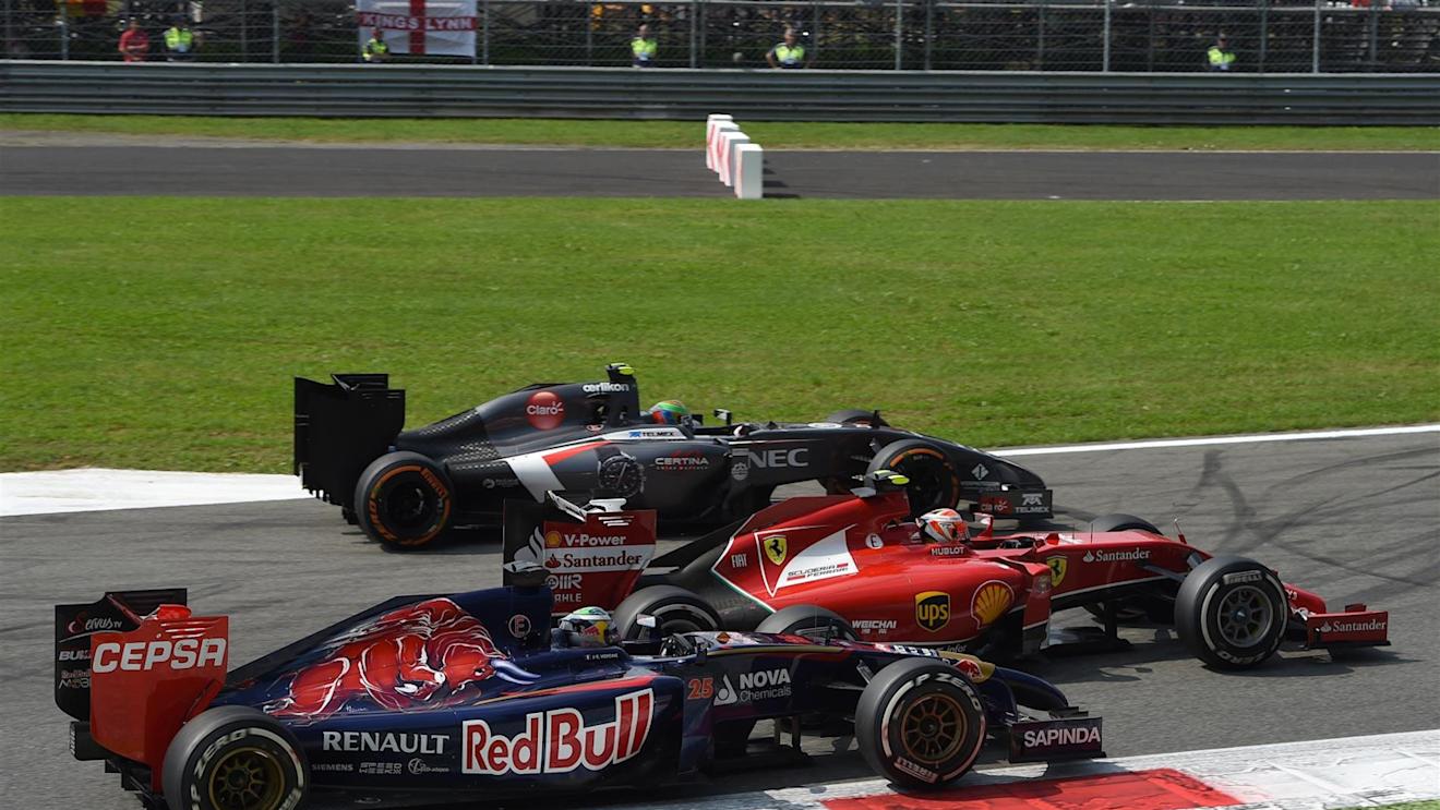 Esteban Gutierrez (MEX) Sauber C33, Kimi Raikkonen (FIN) Ferrari F14 T and Jean-Eric Vergne (FRA) Scuderia Toro Rosso STR9 at the start of the race. Formula One World Championship, Rd13, Italian Grand Prix, Monza, Italy, Race Day, Sunday, 7 September 2014
