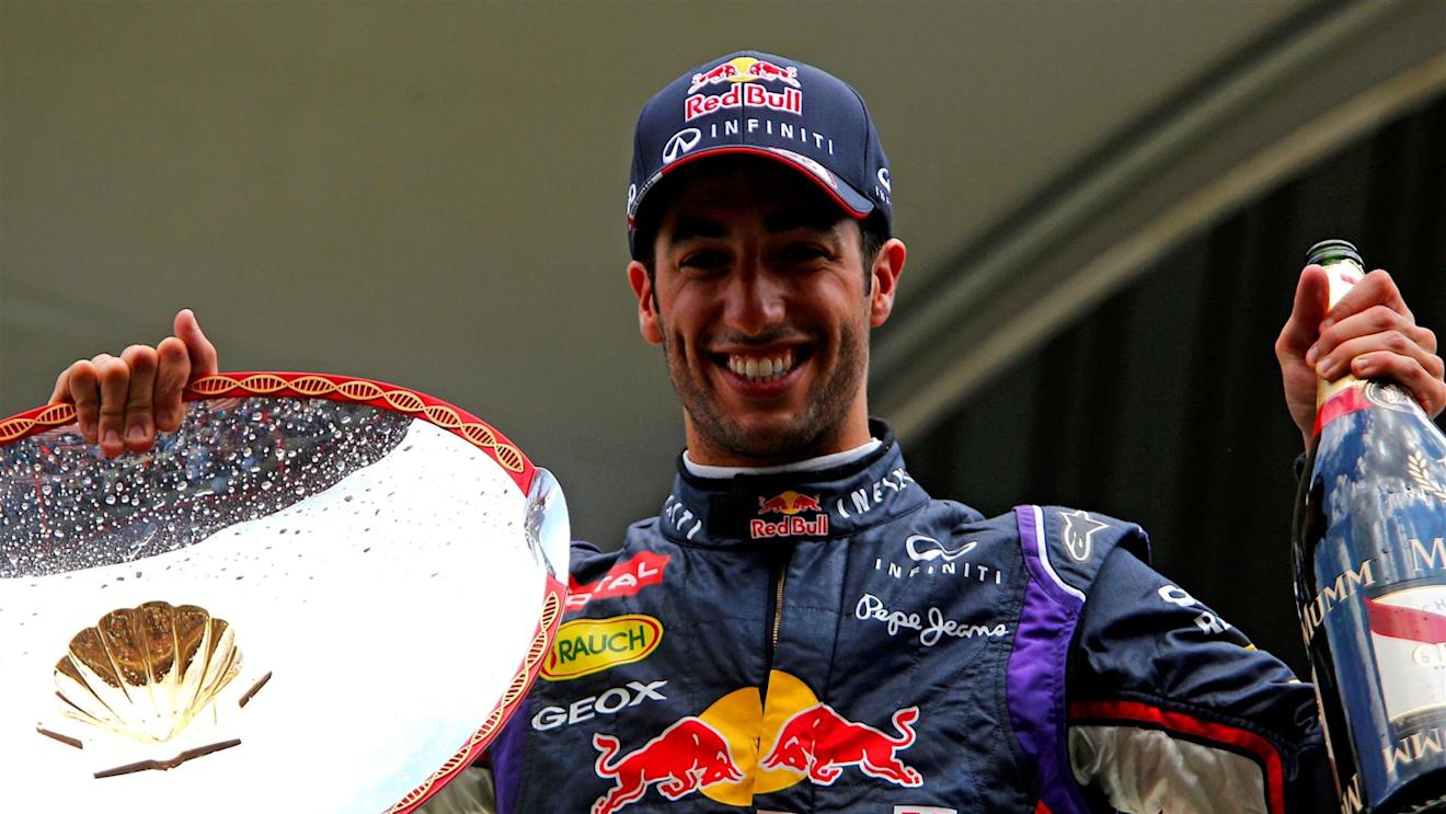 Race winner Daniel Ricciardo (AUS) Red Bull Racing with his trophy and champagne on the podium. Formula One World Championship, Rd12, Belgian Grand Prix, Race Day, Spa-Francorchamps, Belgium, Sunday, 24 August 2014