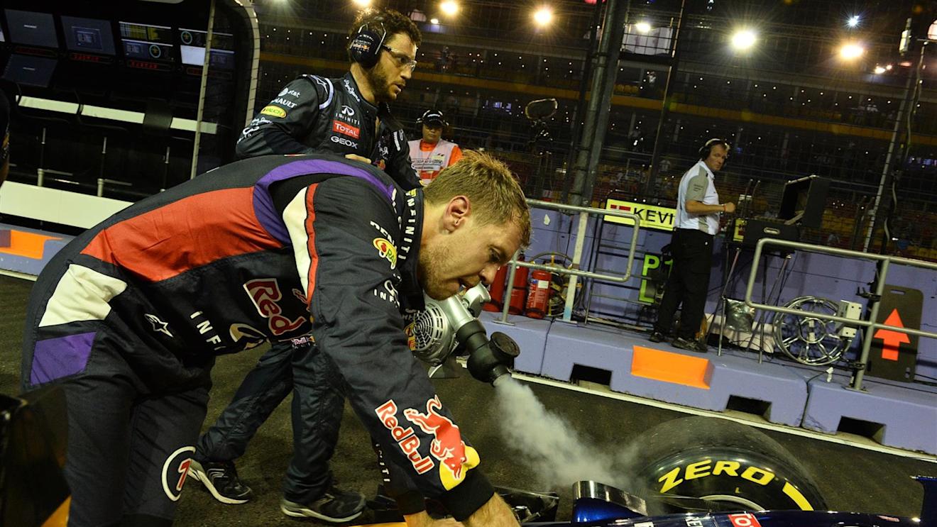 Sebastian Vettel (GER) Red Bull Racing RB10 stopped in pit lane in FP1. Formula One World Championship, Rd14, Singapore Grand Prix, Marina Bay Street Circuit, Singapore, Practice, Friday, 19 September 2014