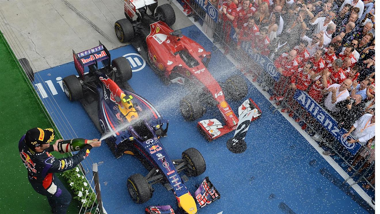 Race winner Daniel Ricciardo (AUS) Red Bull Racing sprays champagne on the podium. Paul Monaghan (GBR) Red Bull Racing Chief Engineer is far left. Formula One World Championship, Rd11, Hungarian Grand Prix, Race Day, Hungaroring, Hungary. Sunday, 27 July 2014