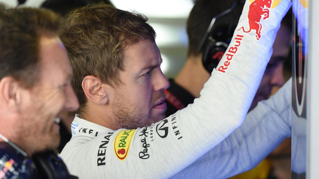Sebastian Vettel (GER) Red Bull Racing and Christian Horner (GBR) Red Bull Racing Team Principal. Formula One World Championship, Rd13, Italian Grand Prix, Monza, Italy, Qualifying, Saturday, 6 September 2014