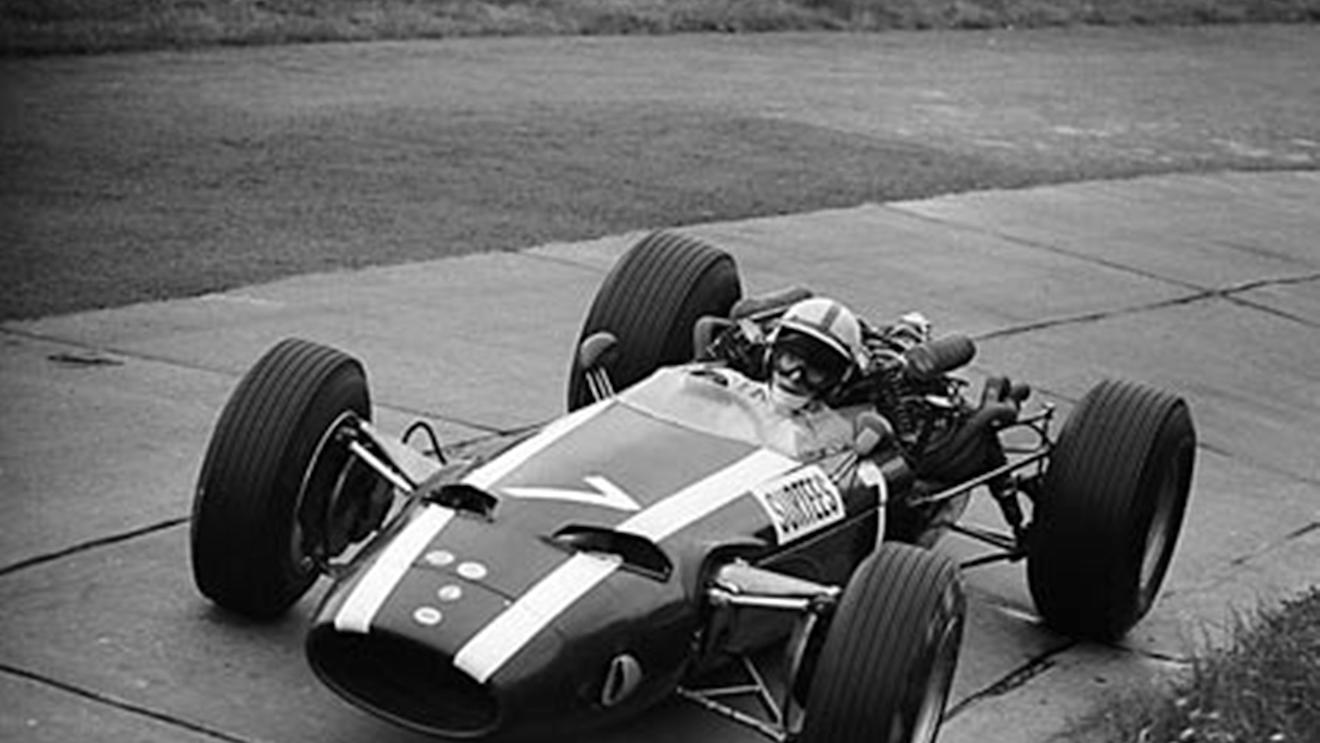 Nurburgring, August 1966: John Surtees in the Cooper T81-Maserati on his way to second place and fastest lap in the German Grand Prix. He went on to take his only victory for the team at the season finale in Mexico. © Schlegelmilch © No reproduction without permission.