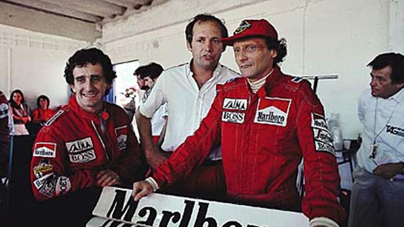 Estoril, October 1984: Niki Lauda pictured with McLaren team mate Alain Prost (left) and team boss Ron Dennis (centre). Lauda would take the world championship by just half a point from Prost. © Schlegelmilch
