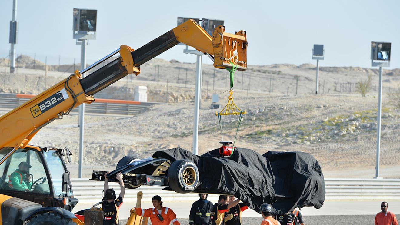 The car of Pastor Maldonado (VEN) Lotus E22 is recovered, Formula One Testing, Day Three, Bahrain International Circuit, Sakhir, Bahrain, Friday, 21 February 2014 © Sutton Images. No reproduction without permission