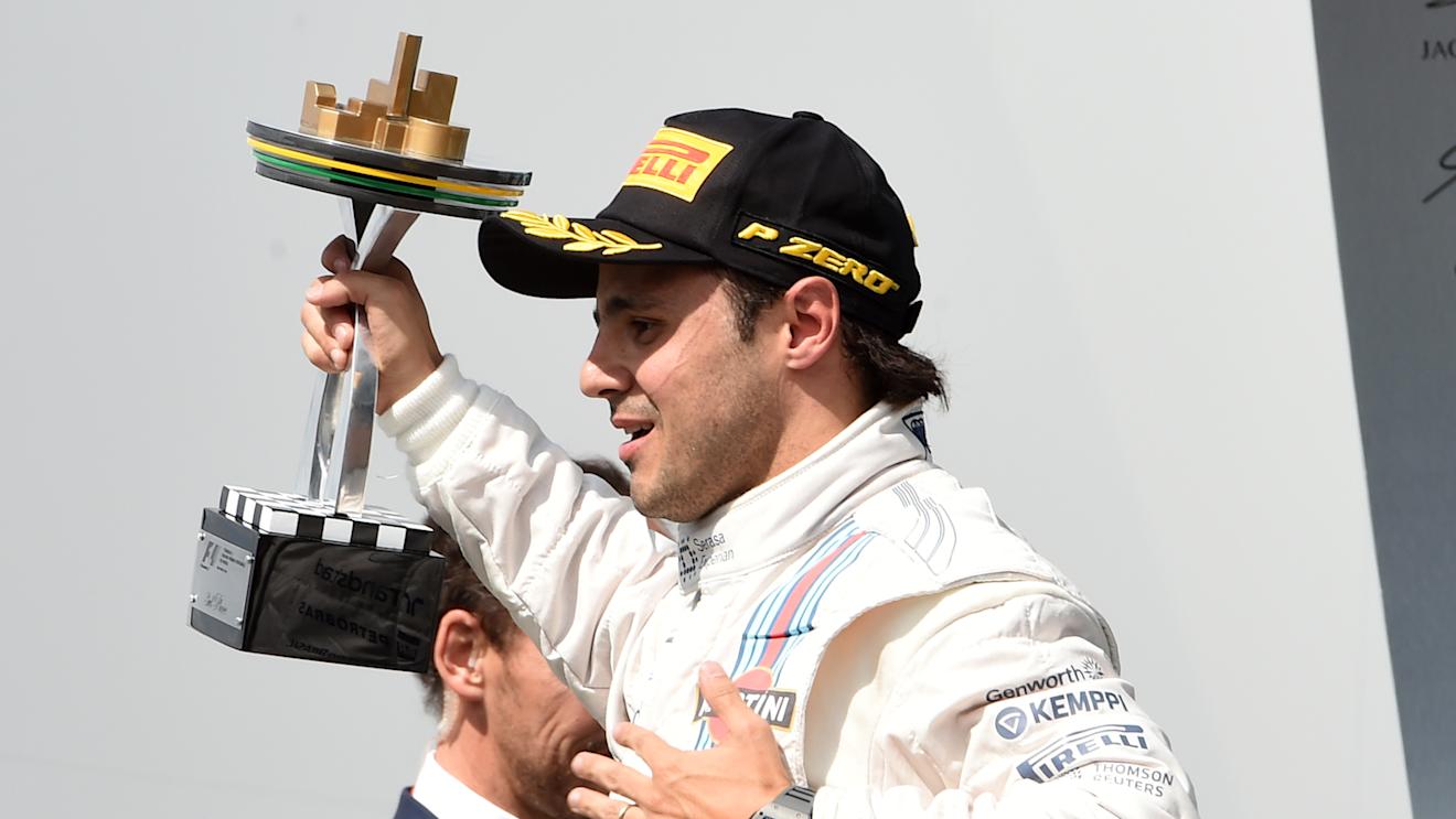 Felipe Massa (BRA) Williams celebrates on the podium with the trophy. Formula One World Championship, Rd18, Brazilian Grand Prix, Race, Sao Paulo, Brazil, Sunday, 9 November 2014
