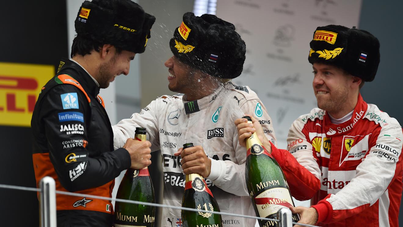 Sergio Perez (MEX) Force India, race winner Lewis Hamilton (GBR) Mercedes AMG F1 and Sebastian Vettel (GER) Ferrari celebrate on the podium with he champagne at Formula One World Championship, Rd15, Russian Grand Prix, Race, Sochi Autodrom, Sochi, Krasnodar Krai, Russia, Sunday 11 October 2015. © Sutton Motorsport Images