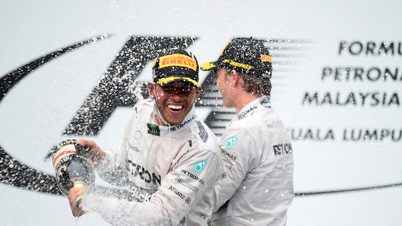 (L to R): race winner Lewis Hamilton (GBR) Mercedes AMG F1 and Nico Rosberg (GER) Mercedes AMG F1 celebrate on the podium with the champagne
Formula One World Championship, Rd2, Malaysian Grand Prix, Race, Sepang, Malaysia, Sunday 30 March 2014. © Sutton Images
