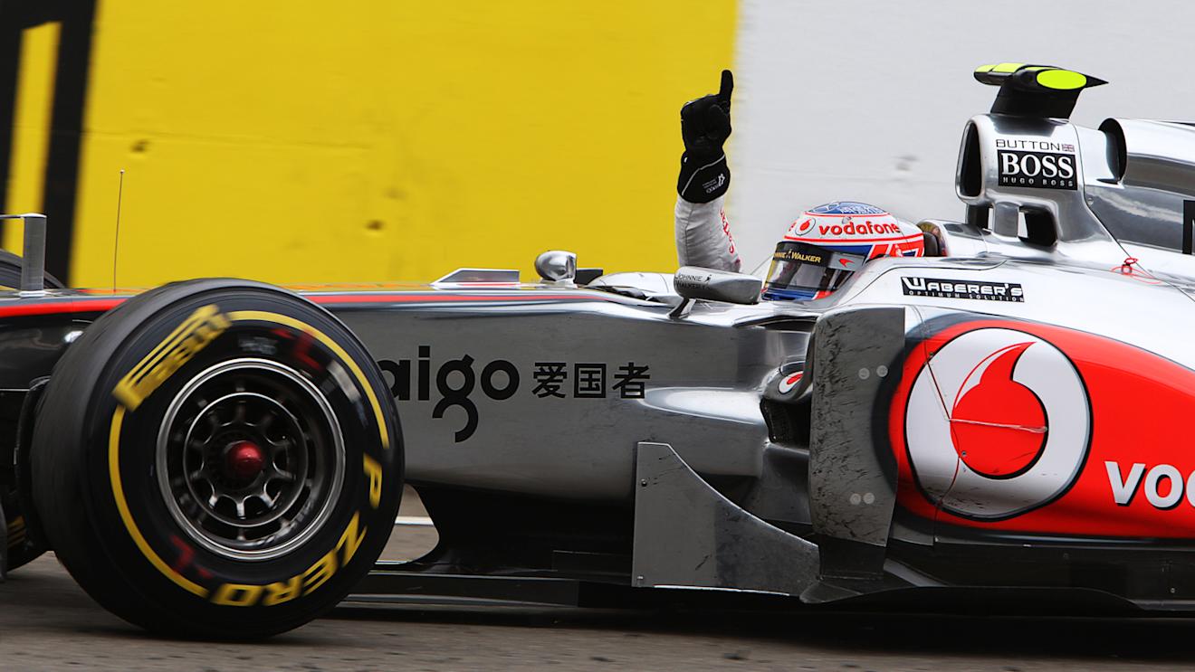 Race winner Jenson Button (GBR) McLaren MP4/26 takes the chequered flag at the finish.Hungarian Grand Prix, Race, Budapest, Hungary, Sunday 31 July 2011.
© Sutton Motorsport Images