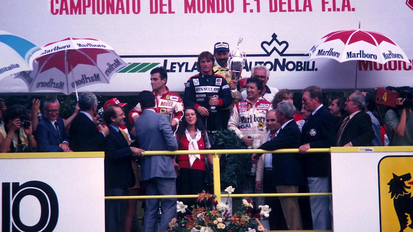 Mario Andretti (far right) is all smiles as he shares the podium with race winner Rene Arnoux and second placed Patrick Tambay. 1982 Italian Grand Prix, Monza. © Sutton Motorsport Images