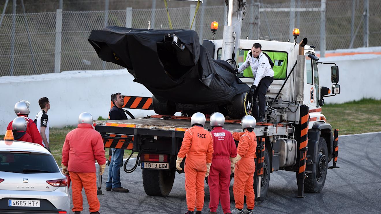 The car of Jenson Button (GBR) McLaren MP4-30 is recovered after stopping on track at Formula One Testing, Day Two, Barcelona, Spain, 27 February 2015.
