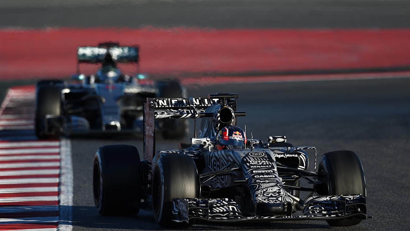 Daniil Kvyat, Red Bull, leads Nico Rosberg, Mercedes
