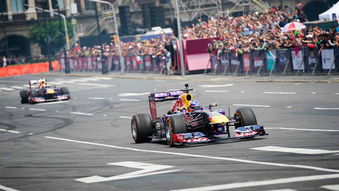 Daniel Ricciardo and Carlos Sainz performs during Infiniti Red Bull Racing F1 Show Run at the Zocalo Plaza in Mexico City on June 27th, 2015 © Marcos Ferro/Red Bull Content Pool