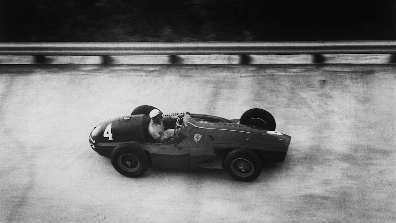 Eugenio Castellotti (Ferrari 555 Supersqualo) tackles the banking in the 1955 race. The following year his left rear tyre threw its tread as he rounded the south banking, spinning him into an infield barrier. He was very lucky to escape injury.  
World Copyright: LAT Photographic.