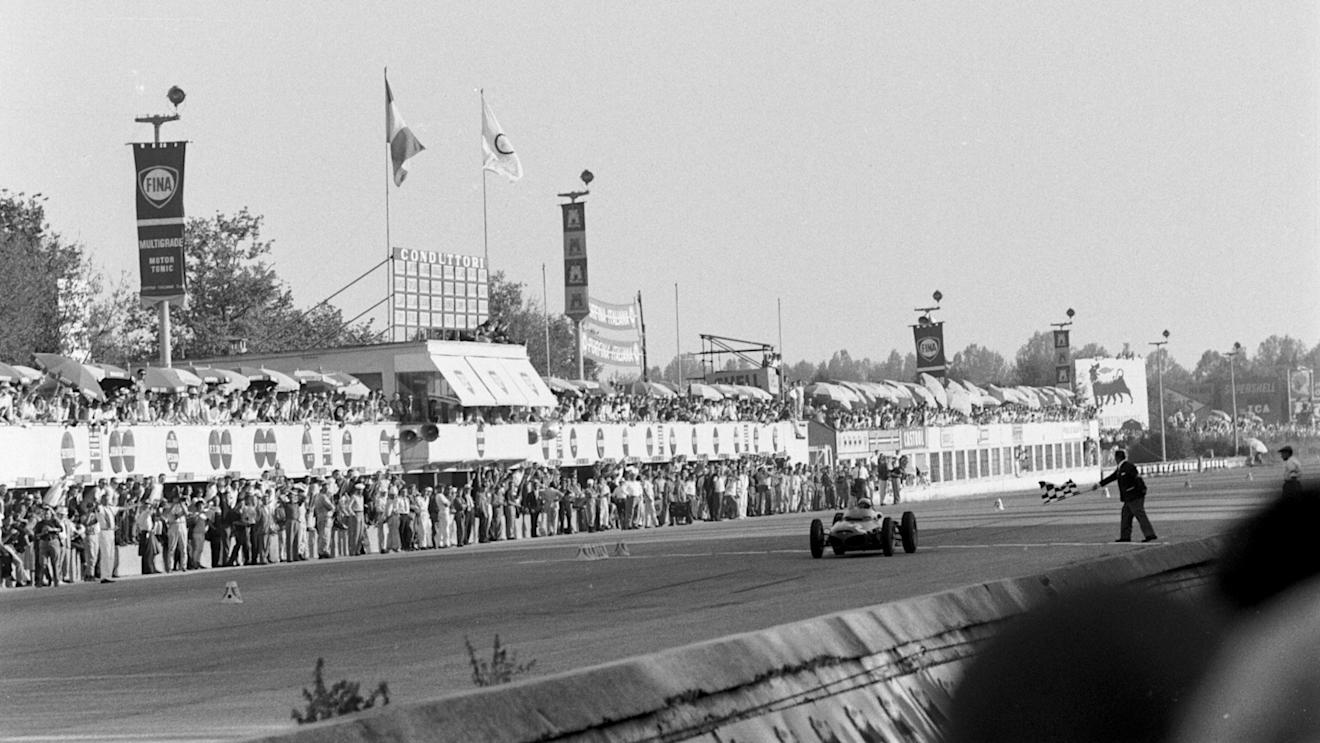 Phil Hill (Ferrari 156) takes the flag to win the tragic 1961 race - the last Grand Prix to use the banking. ©Sutton Motorsport Images