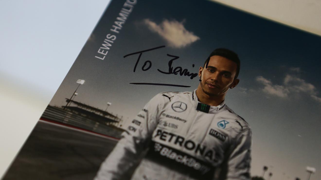 A signed Lewis Hamilton autograph card, dedicated to Formula One group CEO Bernie Ecclestone  © xpbimages.com