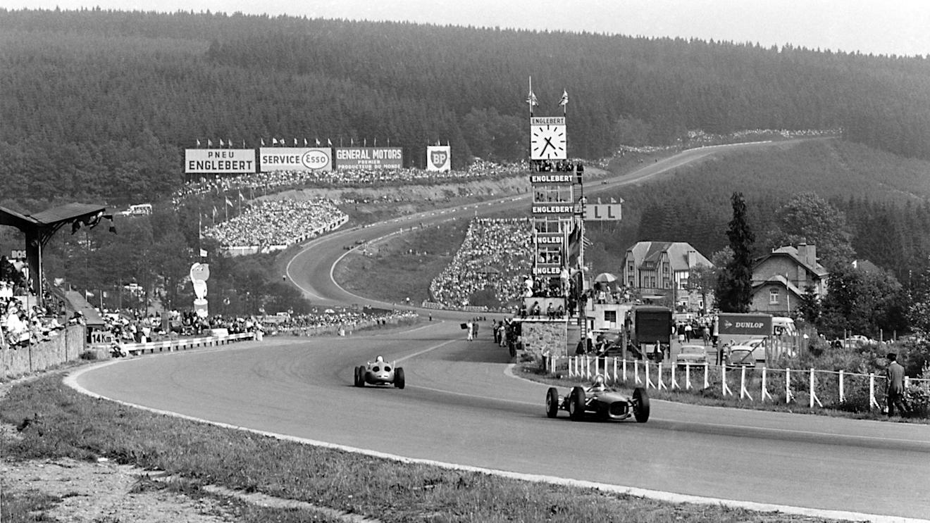Carel Godin de Beaufort (Porsche 718) leads a Ferrari Dino 156 passed the pits towards Eau Rouge. 1962 Belgian Grand Prix. © LAT Photographic