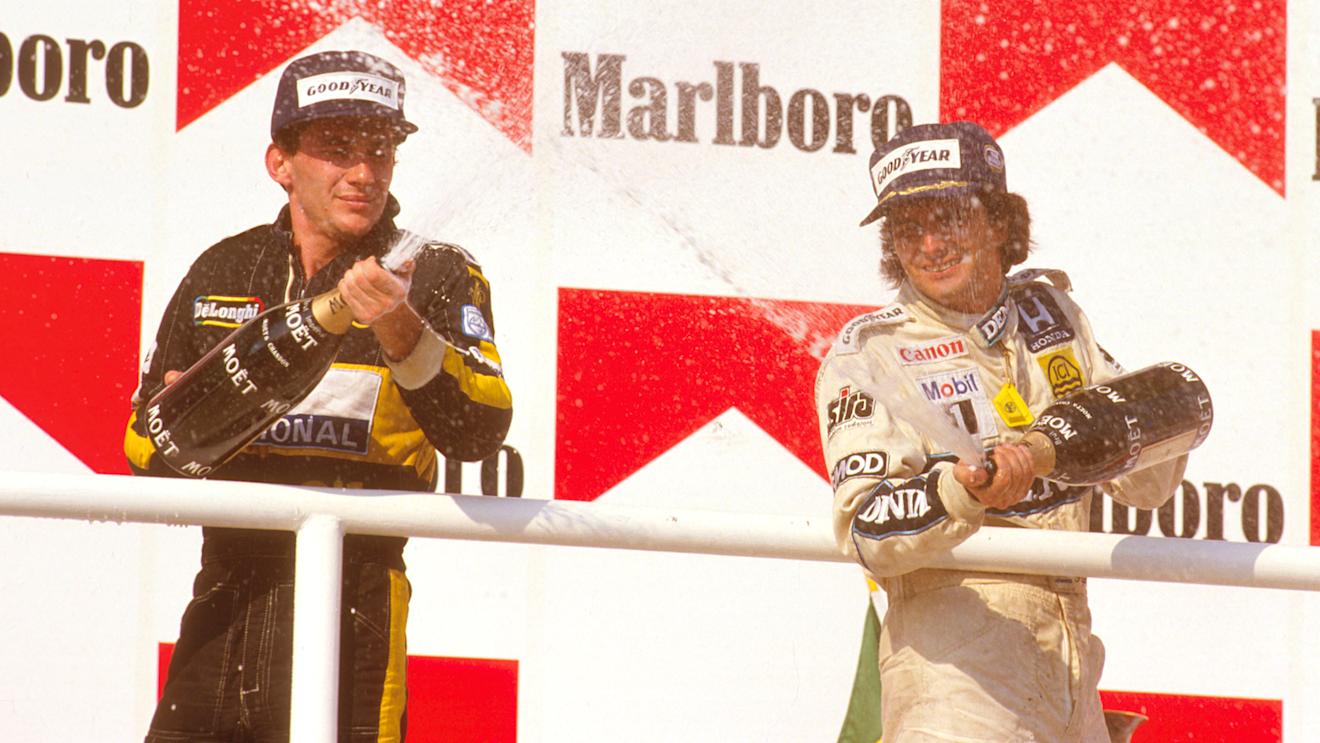 Nelson Piquet (Williams Honda) 1st position with Ayrton Senna (Team Lotus) 2nd position on the podium. Hungaroring, Budapest, Hungary.
8-10 August 1986. World Copyright - LAT Photographic