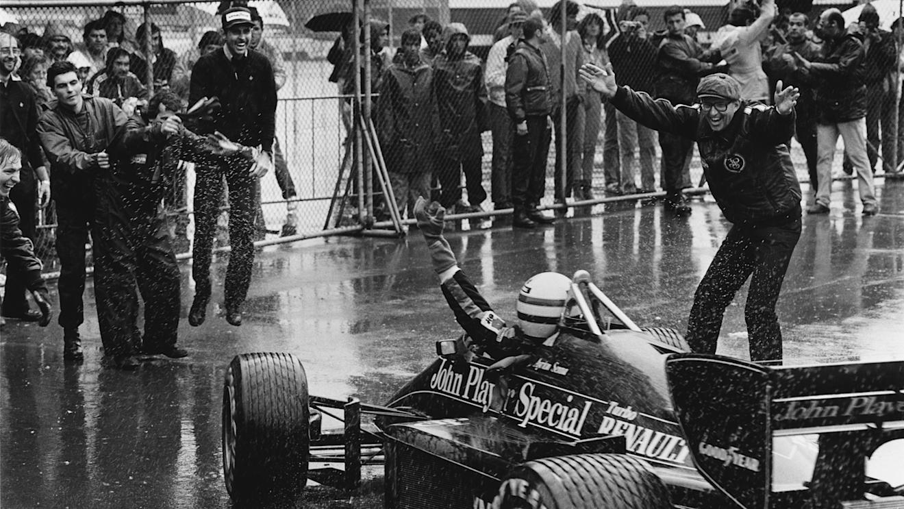 Ayrton Senna (Lotus 97T-Renault) celebrates 1st position with Team Manager Peter Warr (right) in parc ferme. Note Kenny Szymanski looking 'like he's pogoing'. Copyright: LAT Photographic.
