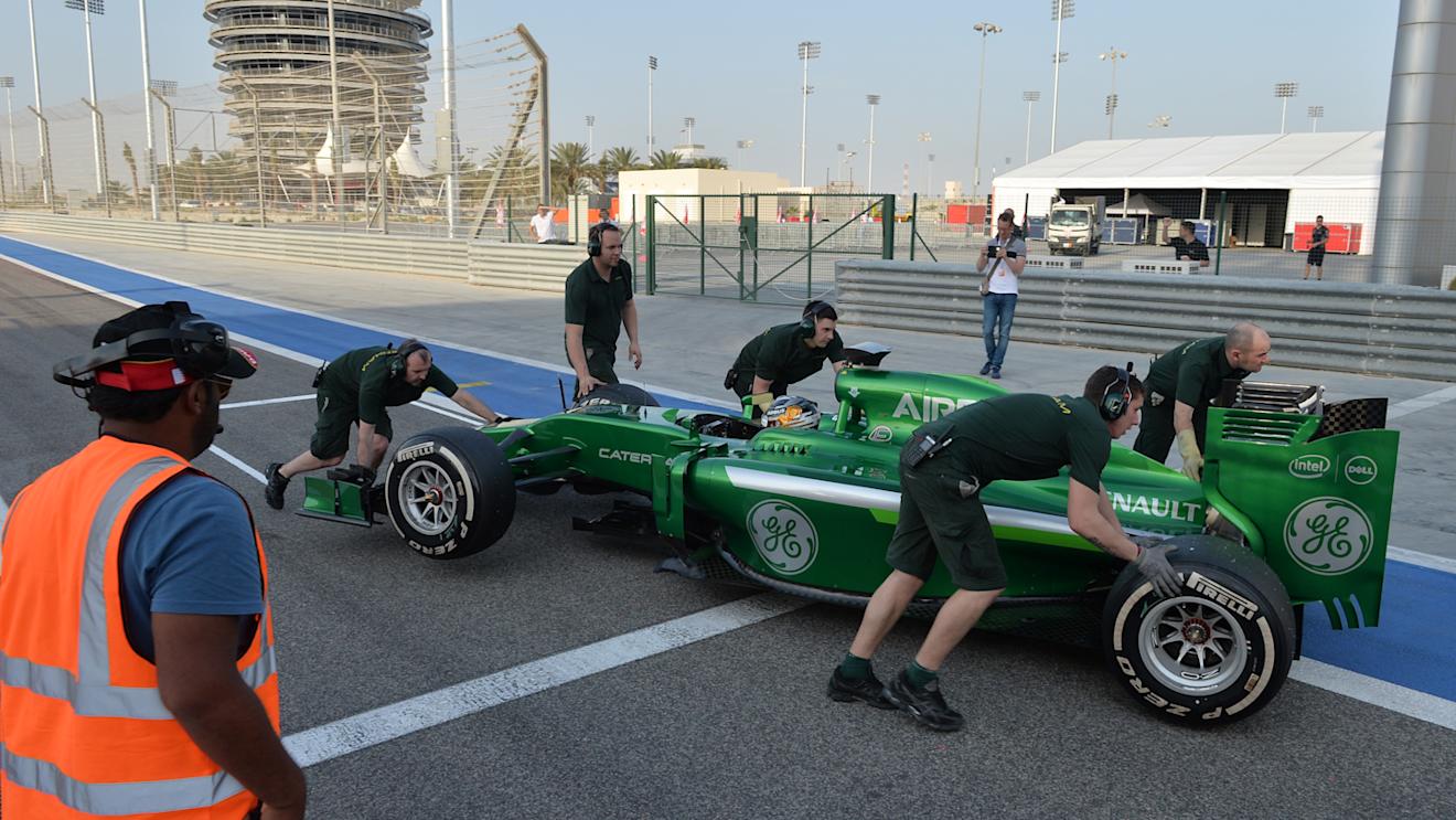 Kamui Kobayashi (JPN) Caterham CT05 stops at the end of pit lane. Formula One Testing, Day One, Bahrain International Circuit, Sakhir, Bahrain, Thursday, 27 February 2014 © Sutton Images. No reproduction without permission