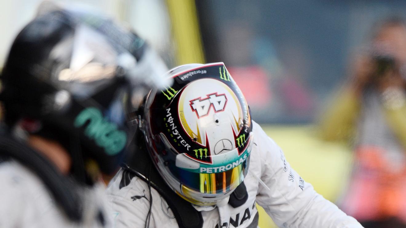 (L to R): Second placed Nico Rosberg (GER) Mercedes AMG F1 and race winner Lewis Hamilton (GBR) Mercedes AMG F1 in parc ferme. Formula One World Championship, Rd16, Russian Grand Prix, Race, Sochi Autodrom, Sochi, Krasnodar Krai, Russia, Sunday, 12 October 2014 © Sutton Images. No reproduction without permission
