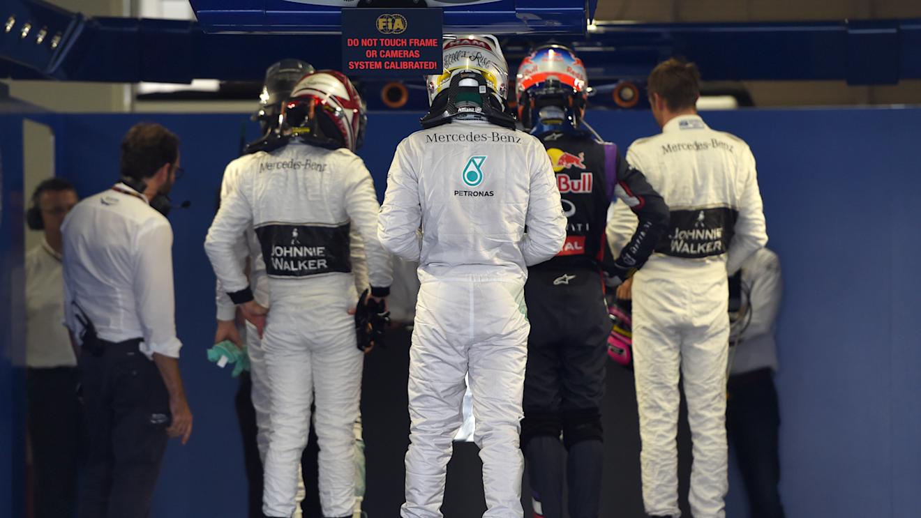 Kevin Magnussen (DEN) McLaren, Lewis Hamilton (GBR) Mercedes AMG F1, Daniel Ricciardo (AUS) Red Bull Racing and Jenson Button (GBR) McLaren get weighed in parc ferme. Formula One World Championship, Rd15, Japanese Grand Prix, Qualifying, Suzuka, Japan © Sutton Images. No reproduction without permission