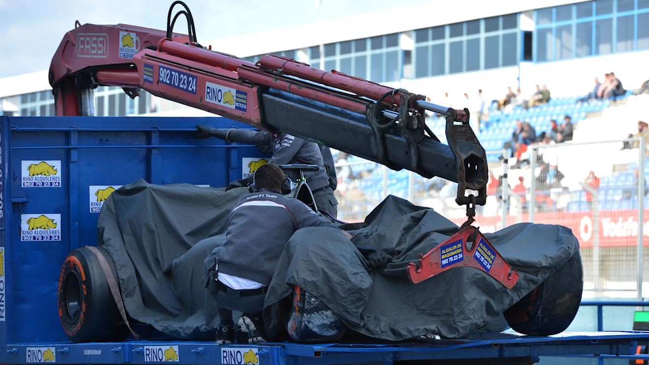The crashed car of Adrian Sutil (GER) Sauber C33 is recovered on a truck. Formula One Testing, Jerez, Spain, Day Three, Thursday, 30 January 2014 © Sutton Images. No reproduction without permission