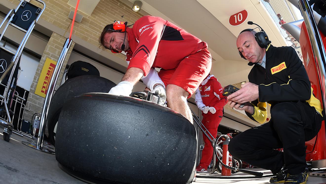 Ferrari and Pirelli engineer and Pirelli tyre. Formula One World Championship, Rd17, United States Grand Prix, Qualifying, Austin, Texas, USA, Saturday, 1 November 2014 © Sutton Images. No reproduction without permission