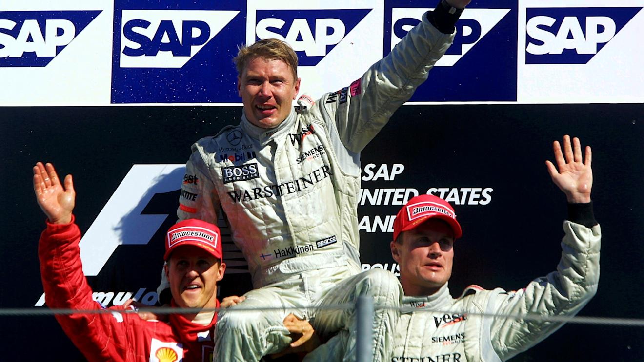 Michael Schumacher (GER) Ferrari F1 2001, Mika Hakkinen(FIN) McLaren Mercedes MP4-16, David Coulthard(GBR) McLaren Mercedes MP4-16 United States Grand Prix, Indianapolis 30 September 2001. World © Bearne/Sutton © No reproduction without permission.