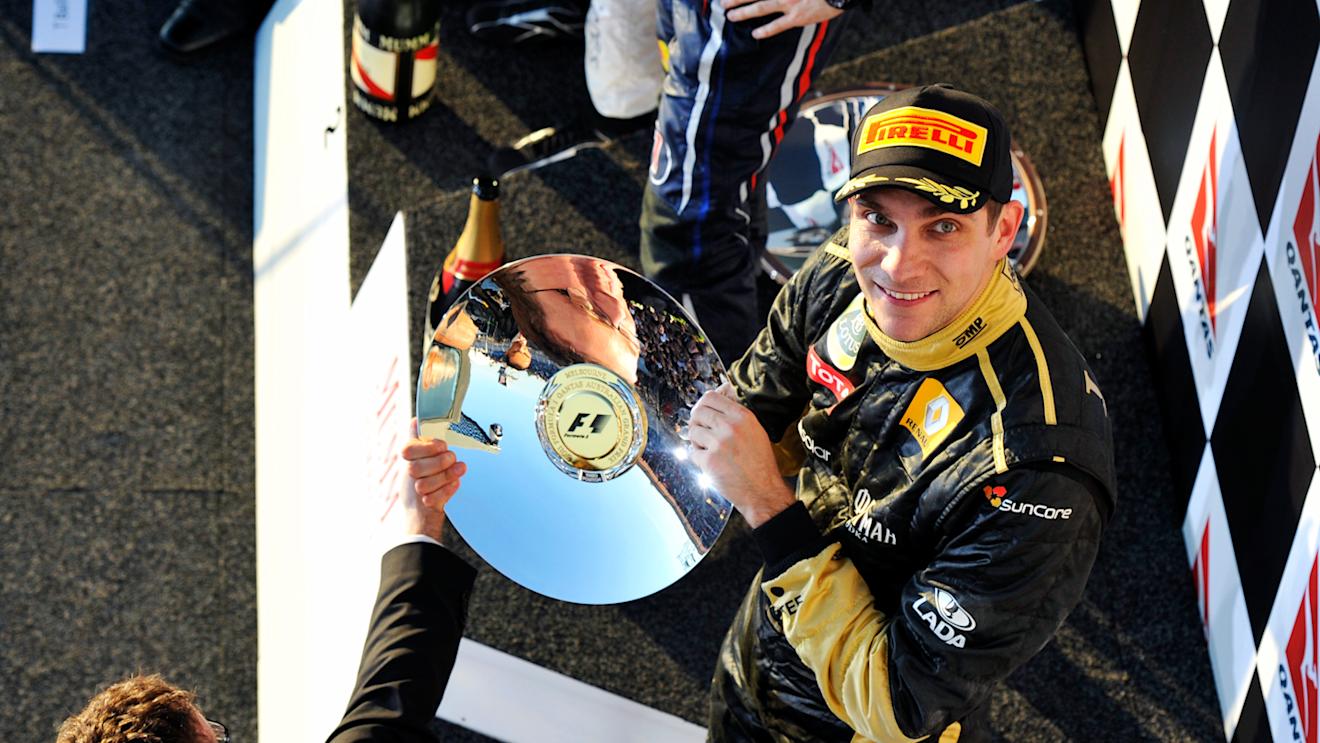 Vitaly Petrov (RUS) Lotus Renault GP celebrates his third position on the podium. Formula One World Championship, Rd 1, Australian Grand Prix, Race, Albert Park, Melbourne, Australia, Sunday, 27 March 2011 © Sutton Images. No reproduction without permission