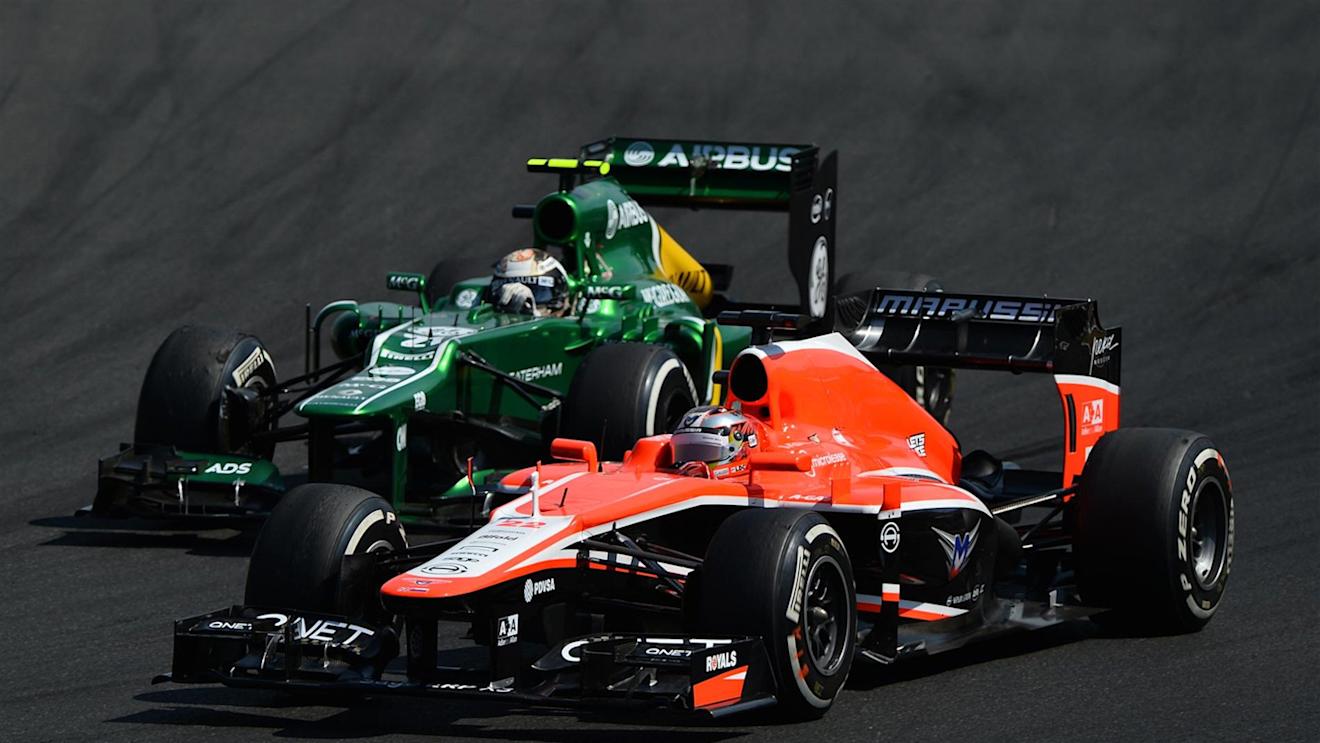 Giedo van der Garde (NDL) Caterham CT03 battles with Jules Bianchi (FRA) Marussia F1 Team MR02. Formula One World Championship, Rd10, Hungarian Grand Prix, Race Day, Hungaroring, Hungary. Sunday, 28 July 2013 © © Sutton Images