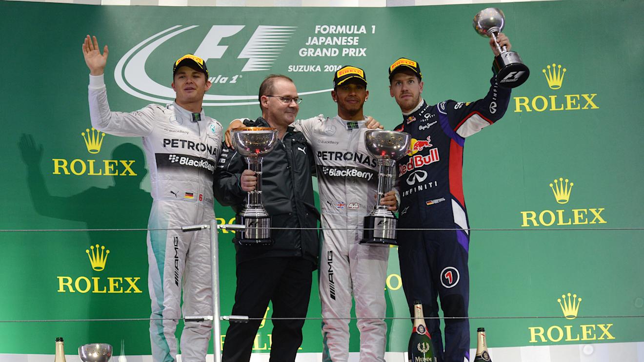 (L to R): Nico Rosberg (GER) Mercedes AMG F1, Peter Hodgkinson (GBR) Mercedes AMG F1 Head of Build, race winner Lewis Hamilton (GBR) Mercedes AMG F1 and Daniel Ricciardo (AUS) Red Bull Racing RB10 on the podium. Formula One World Championship, Rd15, Japanese Grand Prix, Race, Suzuka, Japan, Sunday 5 October 2014. Sutton Images