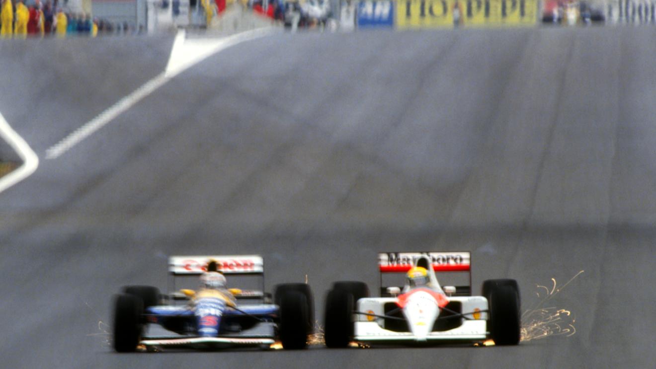 Race winner Nigel Mansell (GBR) Williams FW14 (left) and Ayrton Senna (BRA) McLaren MP4/6 drive wheel to wheel whilst fighting for the lead.
Spanish Grand Prix, Barcelona, 29 September 1991.
 © Sutton Motorsport Images