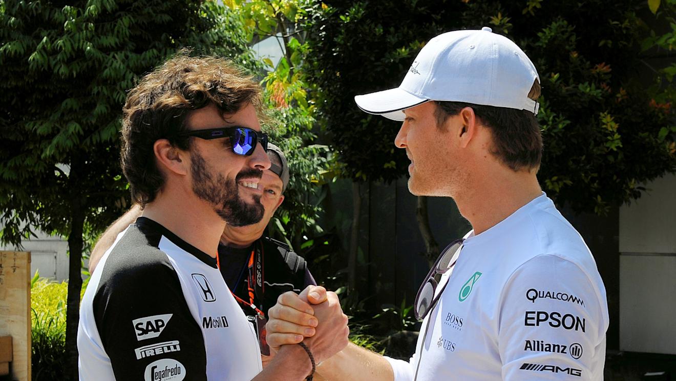 McLaren's Fernando Alonso and Mercedes' Nico Rosberg at Formula One World Championship, Rd2, Malaysian Grand Prix, Preparations, Sepang, Malaysia, Thursday 26 March 2015. © Sutton Motorsport Images