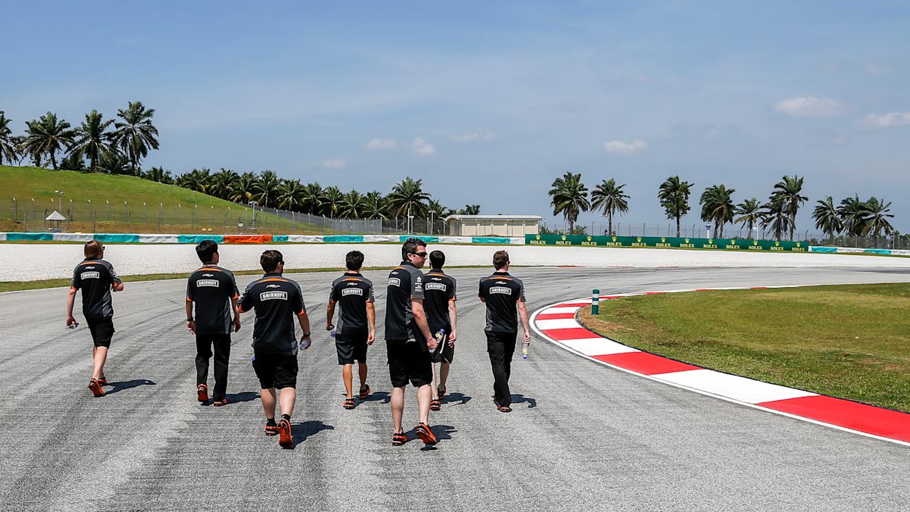 Sergio Perez (Force India) walks the track with members of his team. Malaysian Grand Prix, Preparations, Sepang, Malaysia, Thursday 26 March 2015. © Sutton Motorsport Images