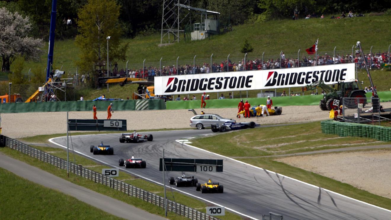 The field head past the crash of Takuma Sato (JPN) Jordan Honda EJ12.
Austrian Grand Prix, A1-Ring, 12 May 2002. © Sutton Motorsport Images