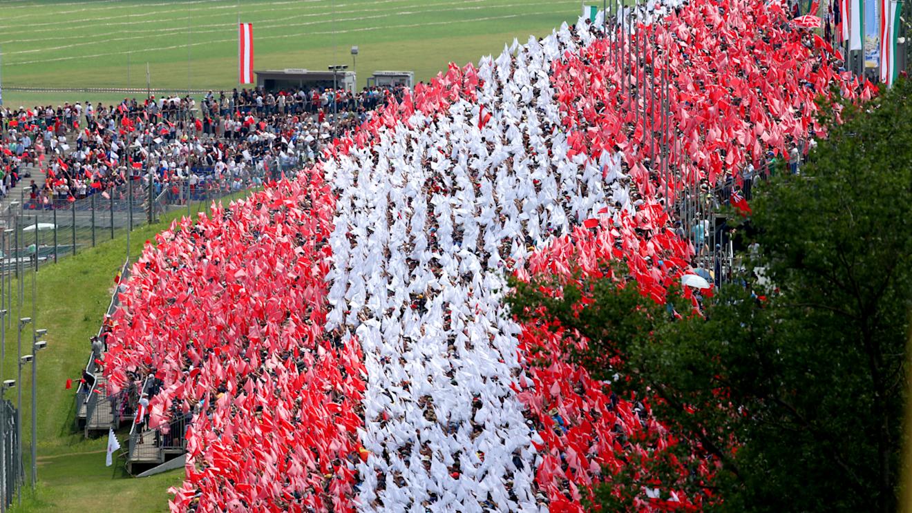 Fans with flags in the grandstand to make the Austrian National flag.
Formula One World Championship, Rd8, Austrian Grand Prix, Race, Spielberg, Austria, Sunday 22 June 2014 © Sutton Motorsport Images