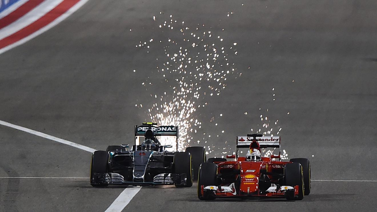 Nico Rosberg (GER) Mercedes AMG F1 W06 overtkes Sebastian Vettel (GER) Ferrari SF15-T at Formula One World Championship, Rd4, Bahrain Grand Prix Race, Bahrain International Circuit, Sakhir, Bahrain, Sunday 19  April 2015. © Sutton Motorsport Images