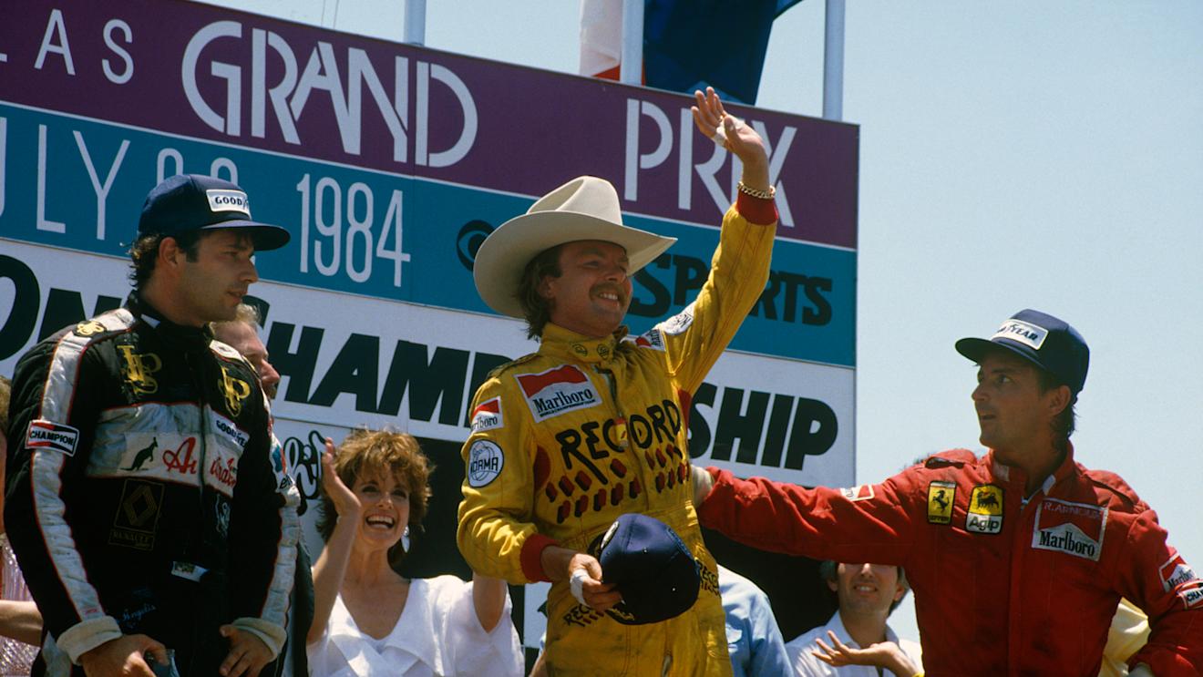 Fair Park, Dallas, Texas, USA. 6-8 July 1984. Keke Rosberg (Williams Honda) 1st position, Elio de Angelis (Team Lotus) 2nd position and Rene Arnoux (Ferrari) 3rd position on the podium. Copyright - LAT Photographic