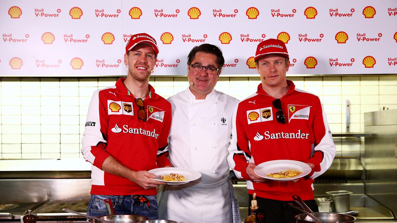 Sebastian Vettel and Kimi Raikkonen pose with chef Guy Grossi in the kitchen of the Merchant Restaurant during a Shell media event on March 12, 2015 in Melbourne, Australia.  © 2015 Getty Images