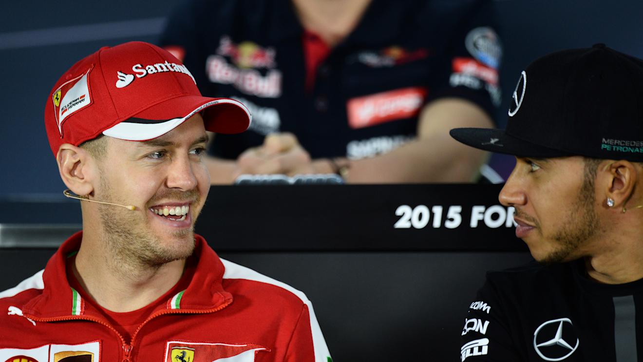 Sebastian Vettel (GER) Ferrari and Lewis Hamilton (GBR) Mercedes AMG F1 during the press conference at Formula One World Championship, Rd1, Australian Grand Prix, Preparations, Albert Park, Melbourne, Australia, Thursday 12 March 2015. © Sutton Motorsport Images