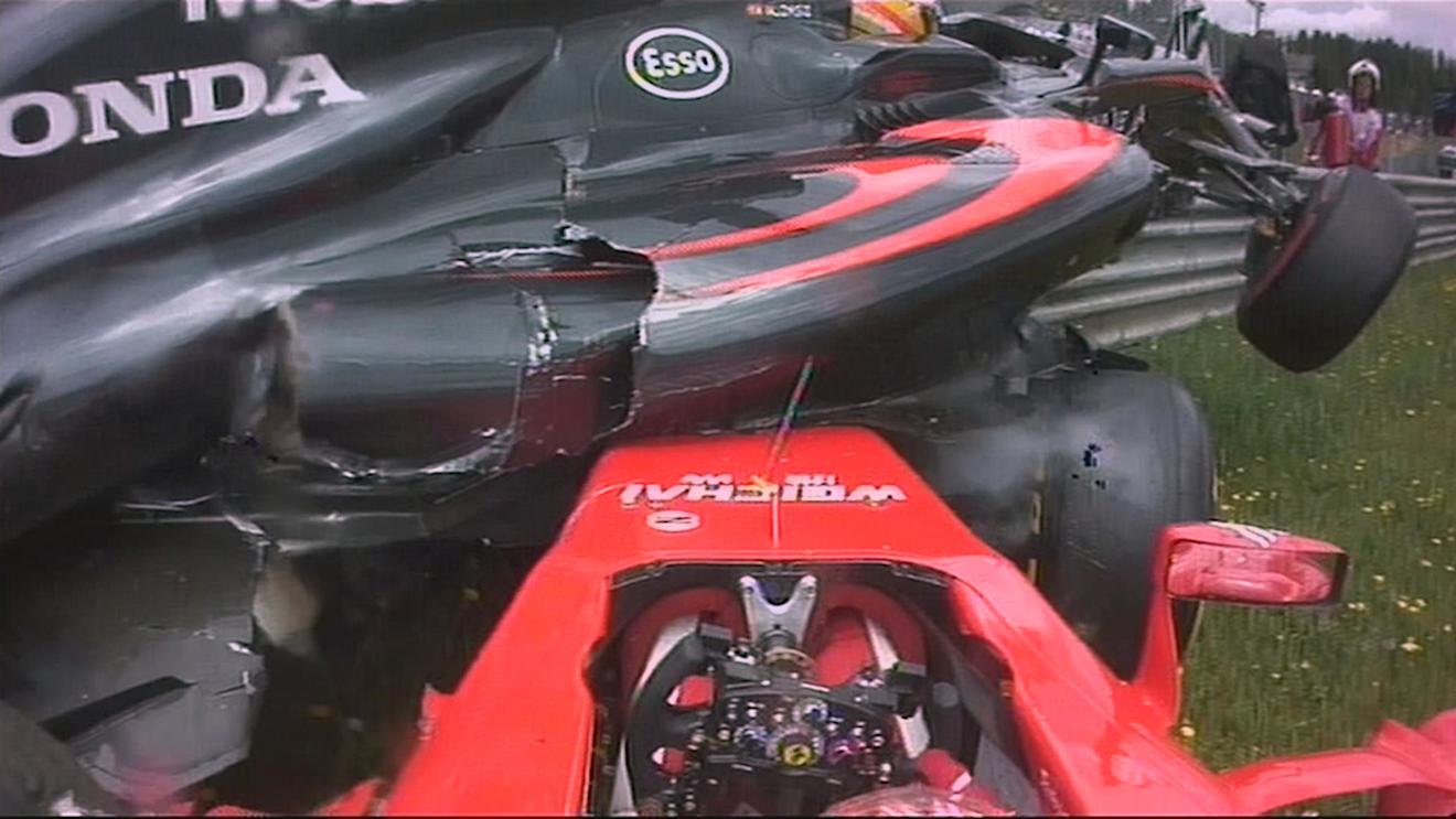 McLaren's Fernando Alonso and Ferrari's Kimi Raikkonen collide on the opening lap in Austria © FOWC Ltd