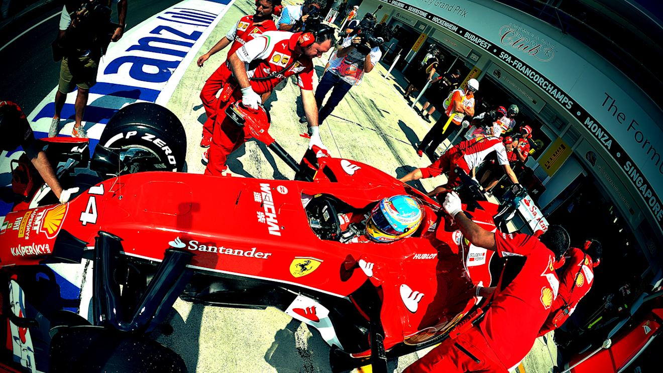 Fernando Alonso (ESP) Ferrari F14 T is pushed back into the garage.
Formula One World Championship, Rd11, Hungarian Grand Prix, Qualifying, Hungaroring, Hungary. Saturday 26 July 2014.
