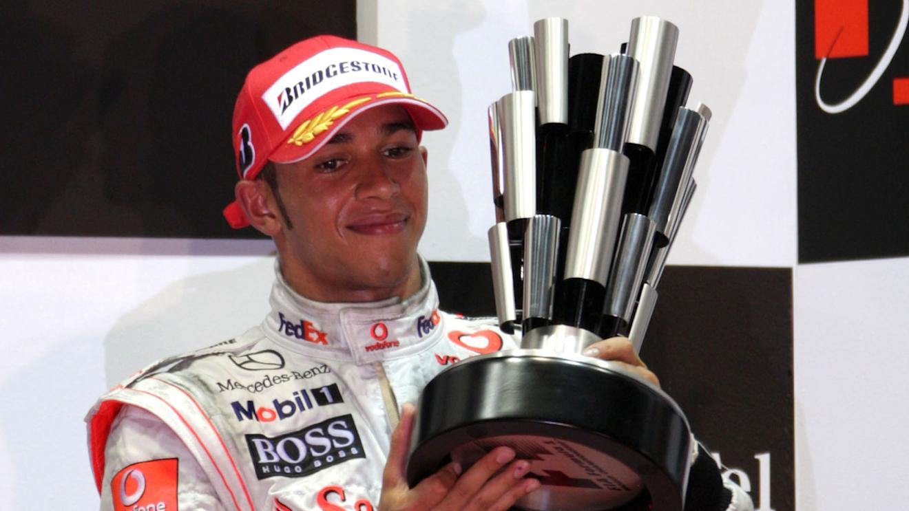 Lewis Hamilton (GBR) McLaren celebrates on the podium 
Formula One World Championship, Rd 15, Singapore Grand Prix, Race, Singapore, Sunday 28 September 2008.

BEST IMAGE © Sutton Motorsport Images