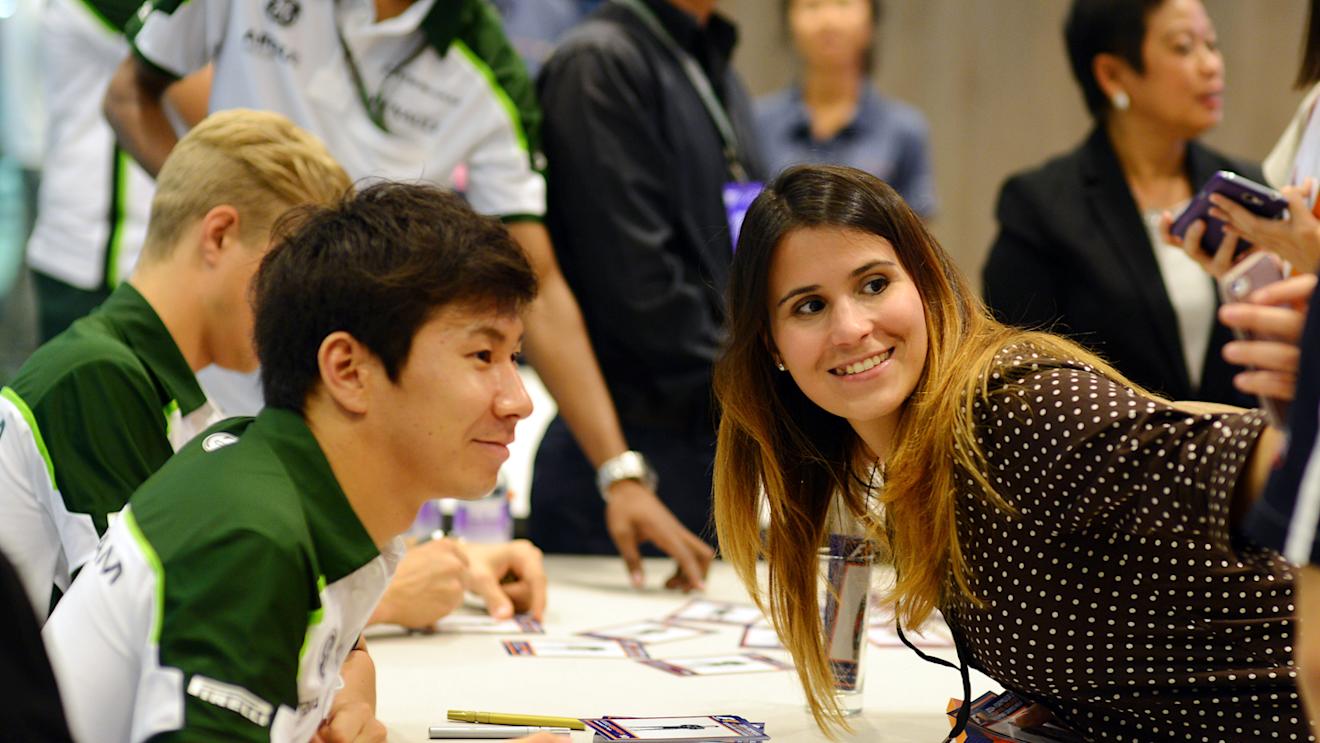 Kamui Kobayashi (JPN) Caterham with a fan in the autograph session.
Formula One World Championship, Rd14, Singapore Grand Prix, Marina Bay Street Circuit, Singapore, Preparations, Thursday 18 September 2014.