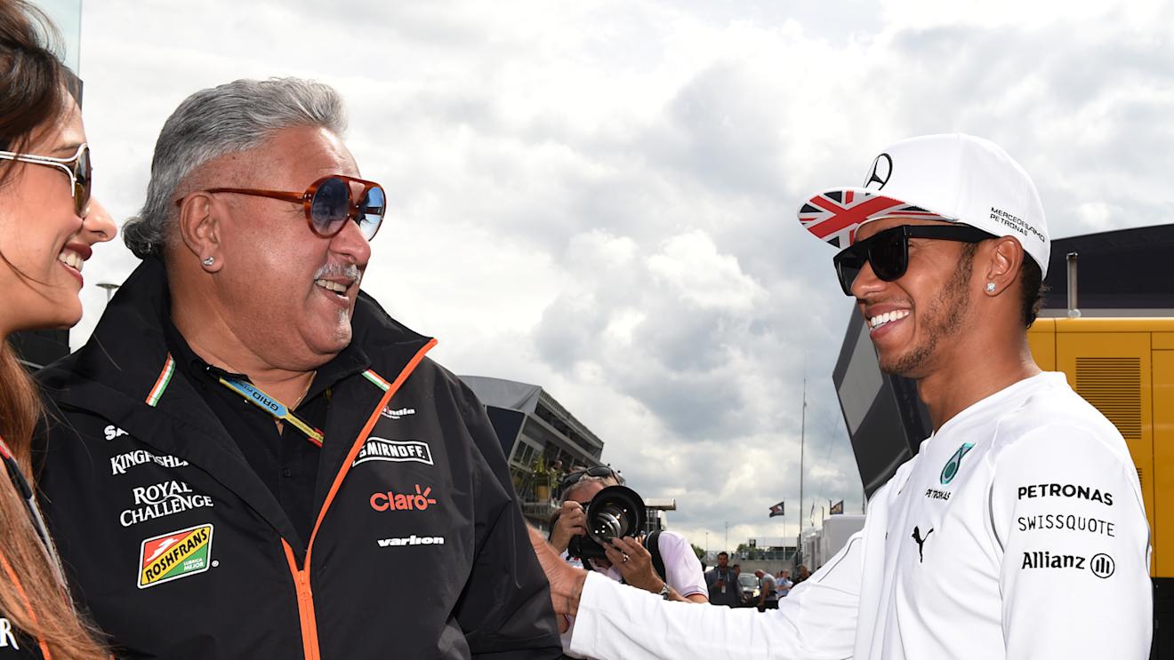 Dr. Vijay Mallya (IND) Force India Formula One Team Owner and Lewis Hamilton (GBR) Mercedes AMG F1.
Formula One World Championship, Rd9, British Grand Prix, Qualifying, Silverstone, England, Saturday 5 July 2014.