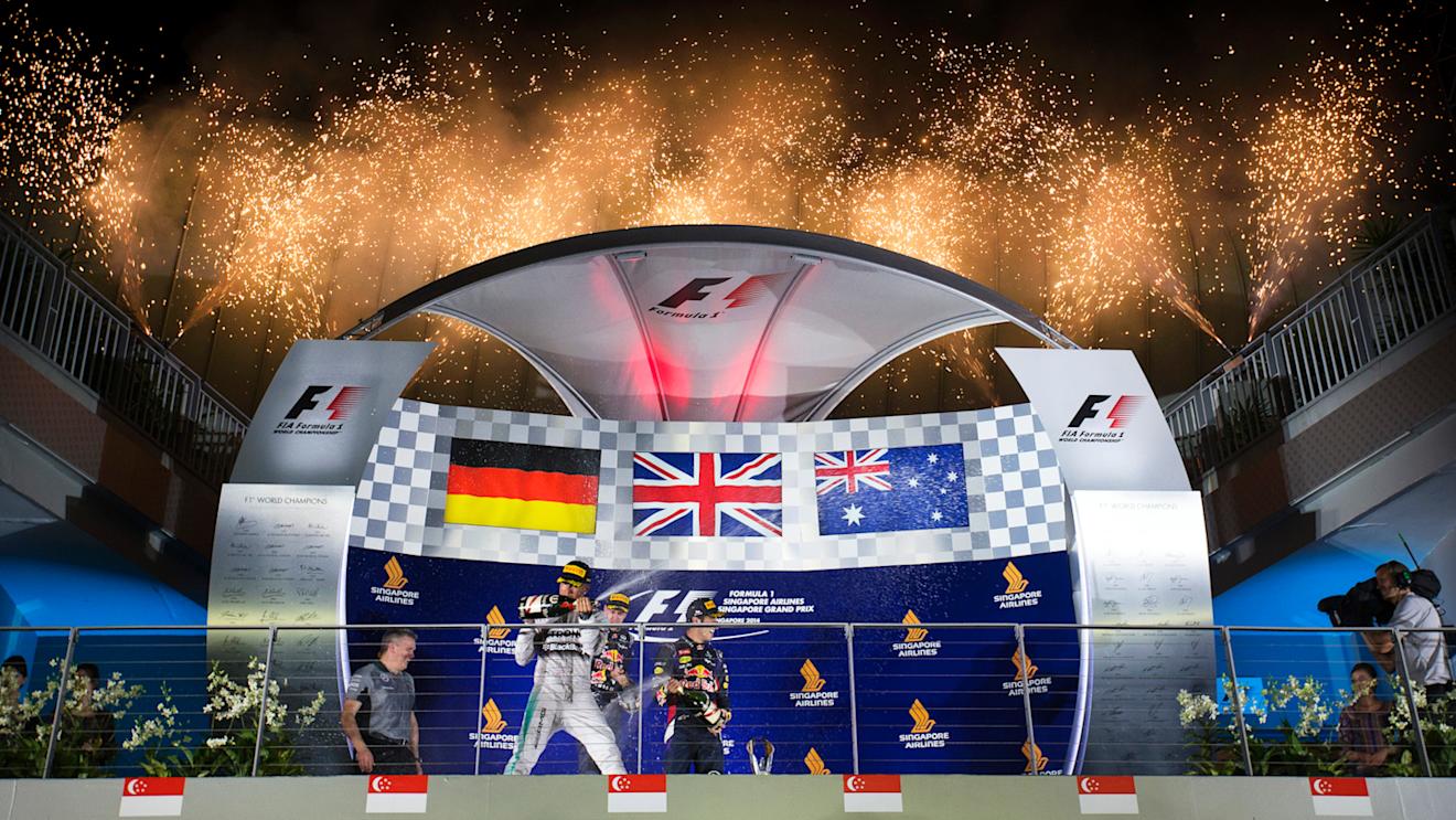 Lewis Hamilton (GBR) Mercedes AMG F1, Sebastian Vettel (GER) Red Bull Racing and Daniel Ricciardo (AUS) Red Bull Racing celebrate on the podium with the champagne.
Formula One World Championship, Rd14, Singapore Grand Prix, Marina Bay Street Circuit, Singapore, Race Day, Sunday 21 September 2014. © Sutton Motorsport Images