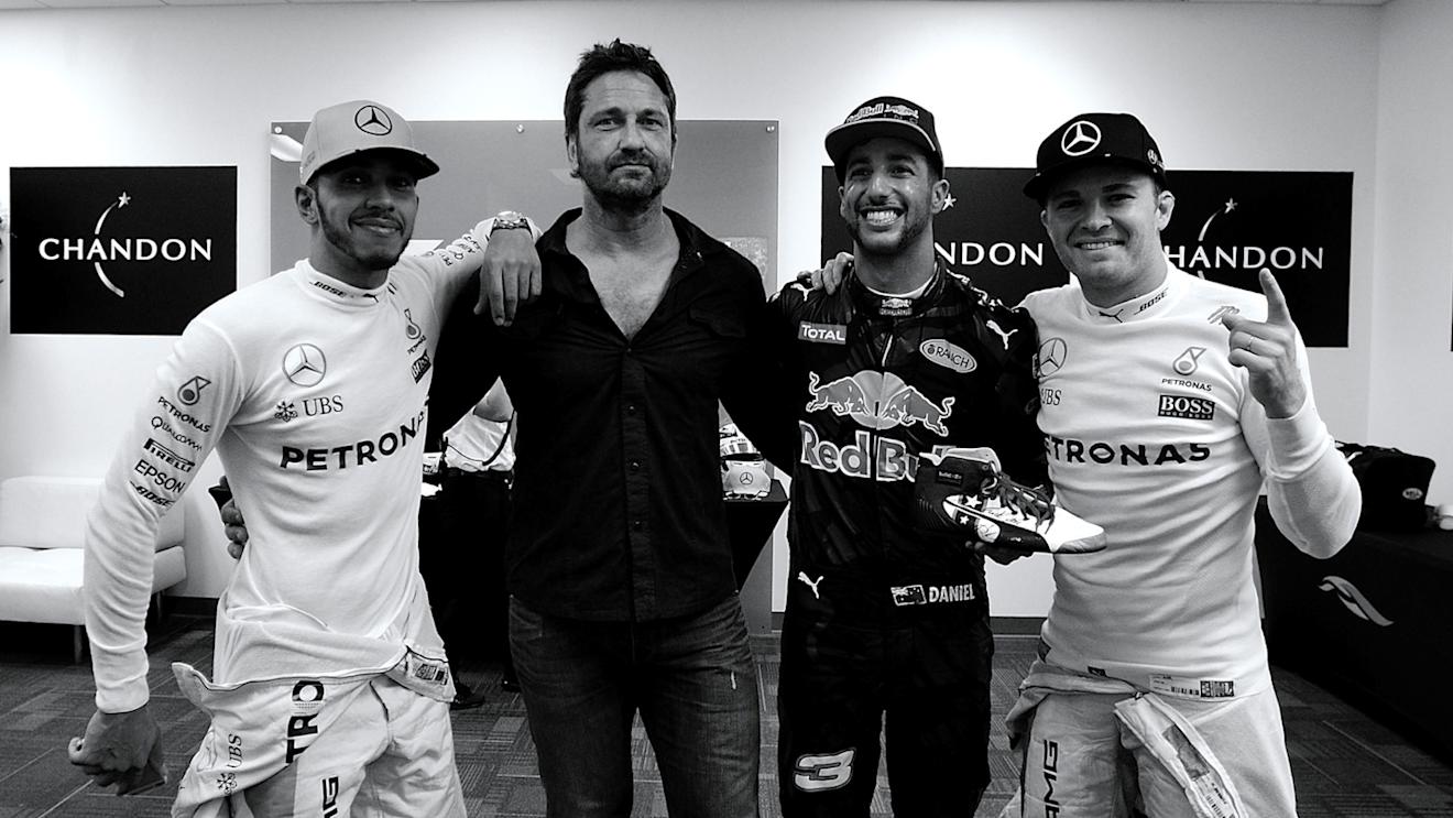 (L to R) Podium finishers Lewis Hamilton, 1st, Mercedes; Daniel Ricciardo, 3rd, Red Bull; Nico Rosberg 2nd, Mercedes, with actor Gerard Butler, 2016 Formula 1 United States Grand Prix, Austin © FOWC Ltd