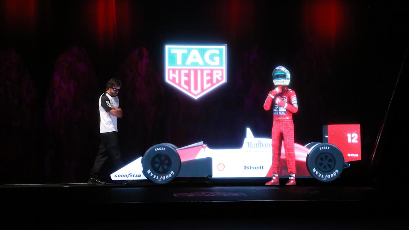 McLaren’s Fernando Alonso comes face to face with a hologram of the late Ayrton Senna at team sponsor event, Barcelona, Spain, May 2015 © TAG Heuer